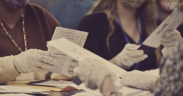 Old-looking photo of people hand counting ballots