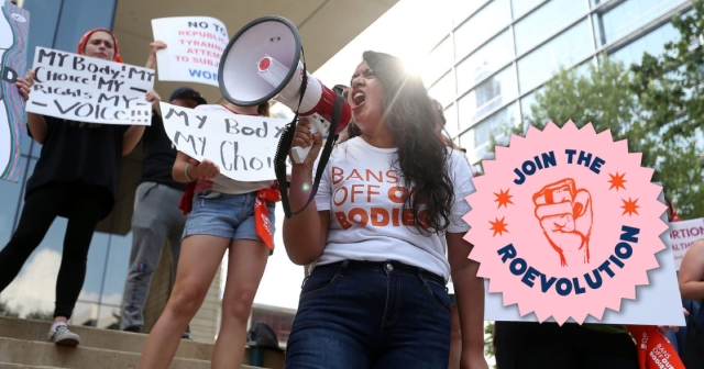 Diana Gomez speaking into a megaphone